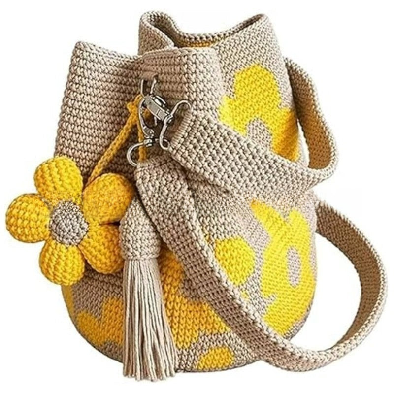 Bolso de mano con flor y borlón