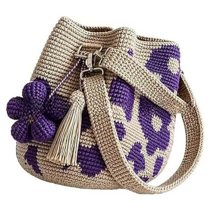 Bolso de mano con flor y borlón